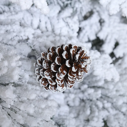 Snow-Frosted Christmas Tree with Pinecones