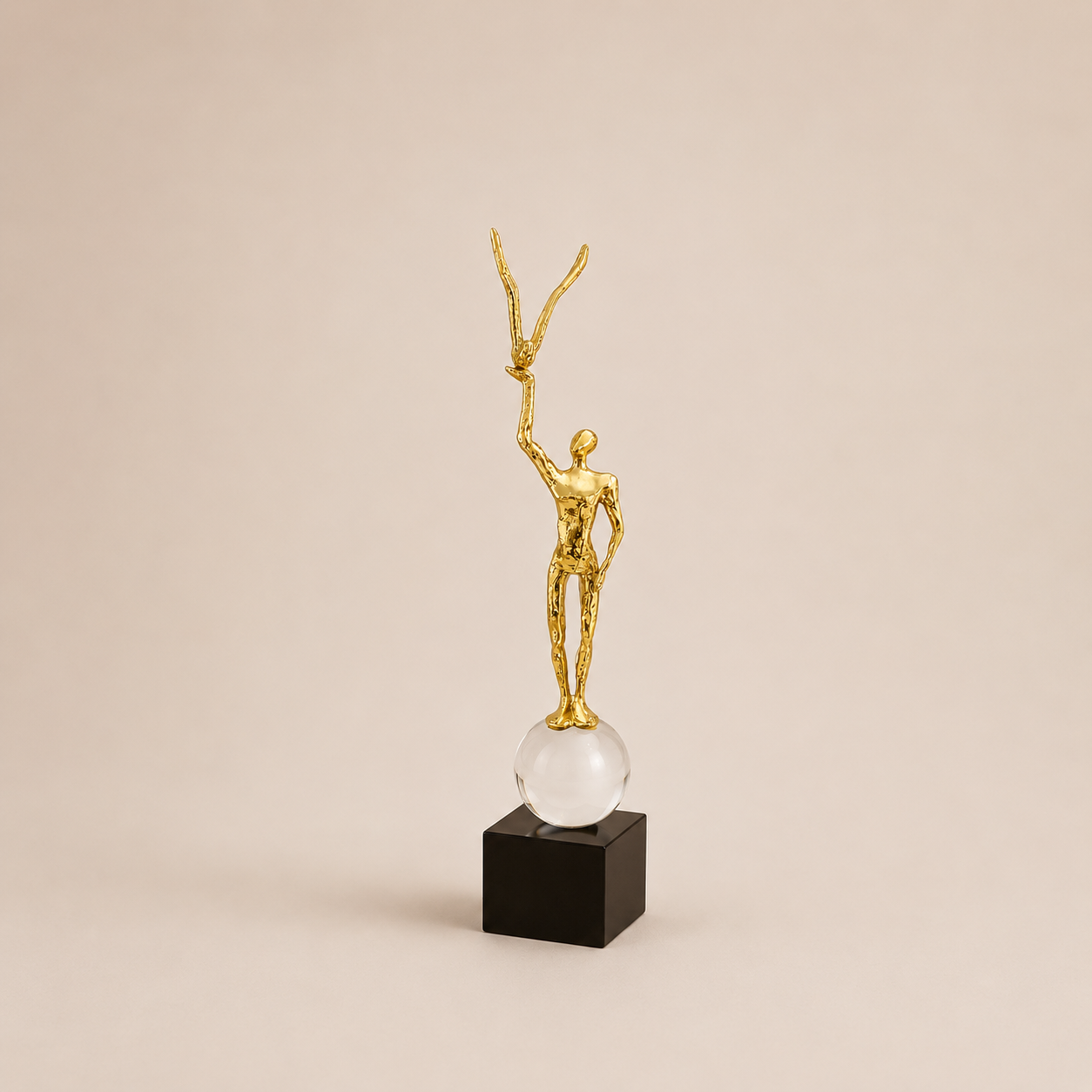Modern Gold Sculpture Holding a Bird