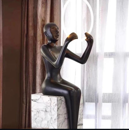 Led Lamp Sculpture Setting On A Metal Podium